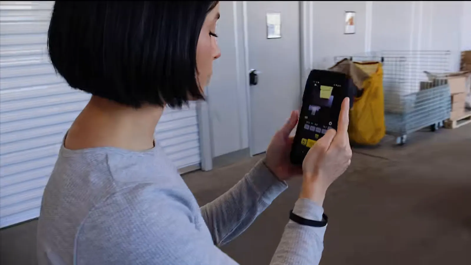 An operator in a warehouse checks a scan on the M2